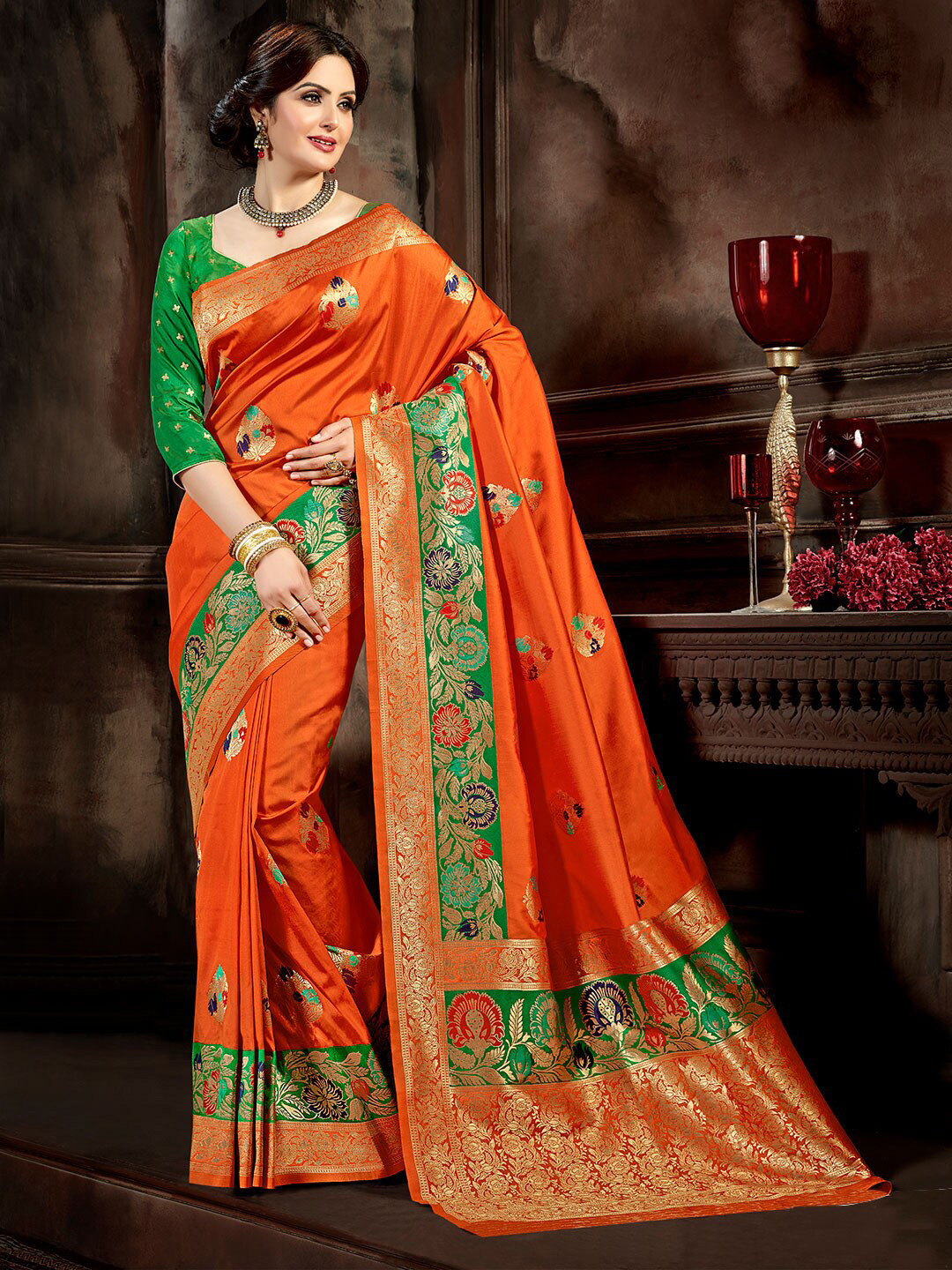 

Shaily Orange & Green Woven Design Zari Silk Blend Banarasi Saree