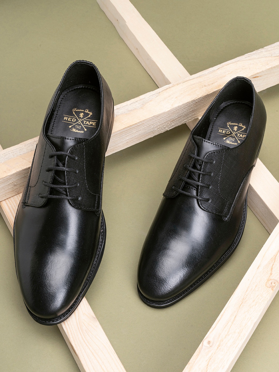 

Red Tape Men Black Solid Leather Formal Derbys