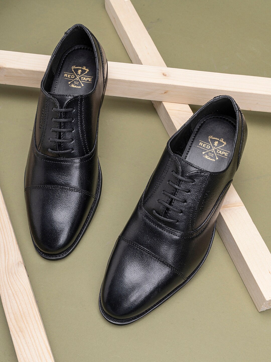 

Red Tape Men Black Solid Leather Formal Oxfords