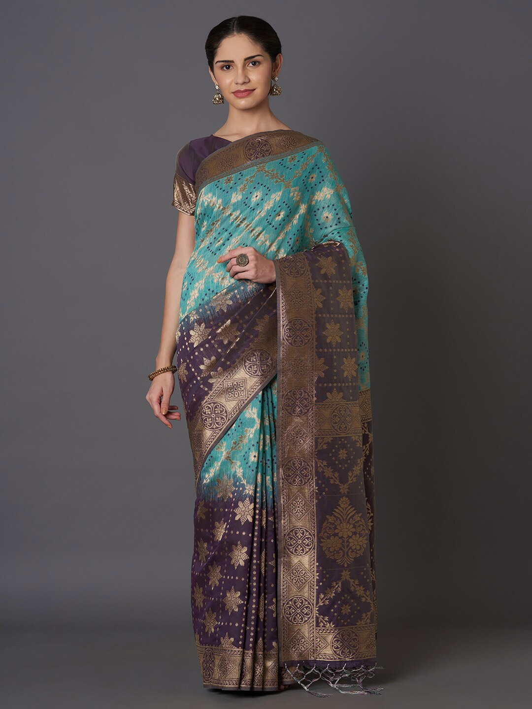 

Mitera Teal & Purple Ethnic Motifs Zari Silk Blend Kasavu Saree