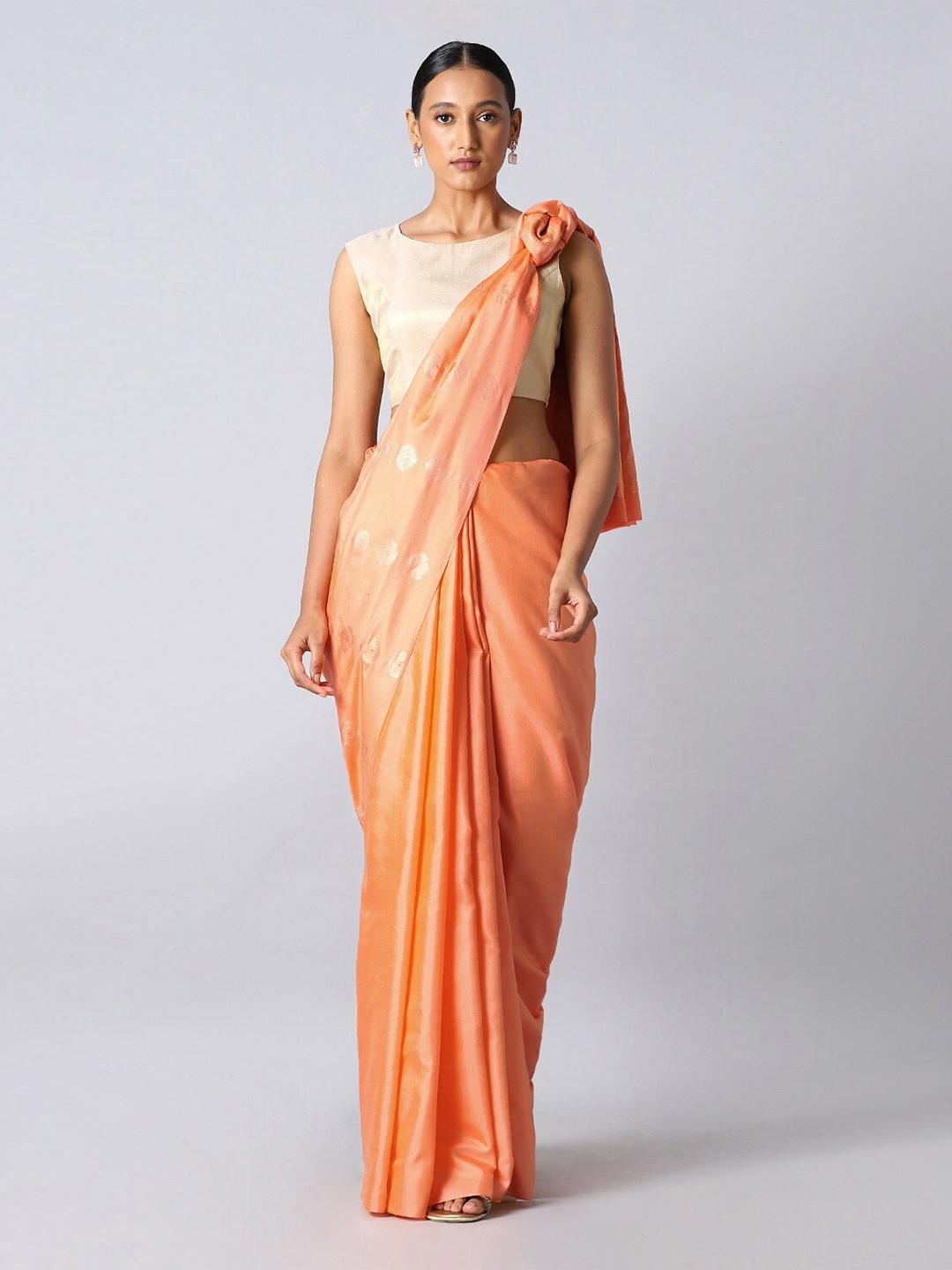 

Taneira Light Orange Woven Design Pure Silk Saree