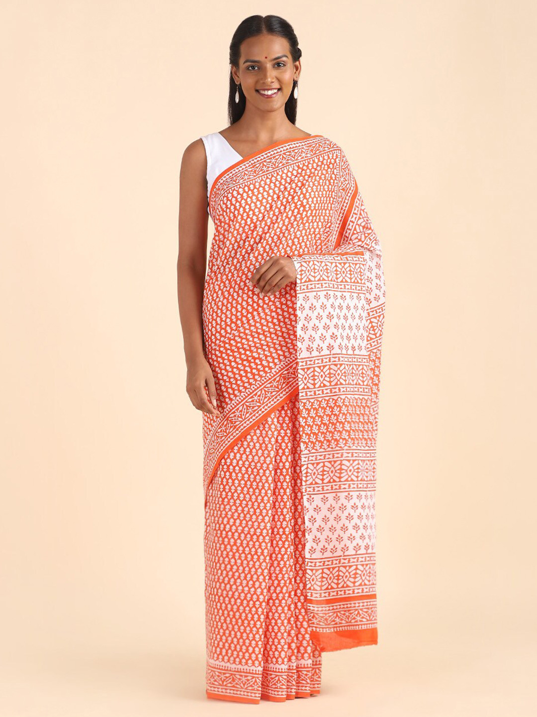 

Taneira Women Orange & White Ethnic Motifs Pure Cotton Block Print Saree