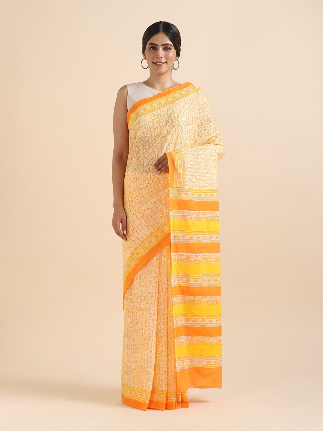 

Taneira Yellow & Orange Warli Pure Cotton Saree