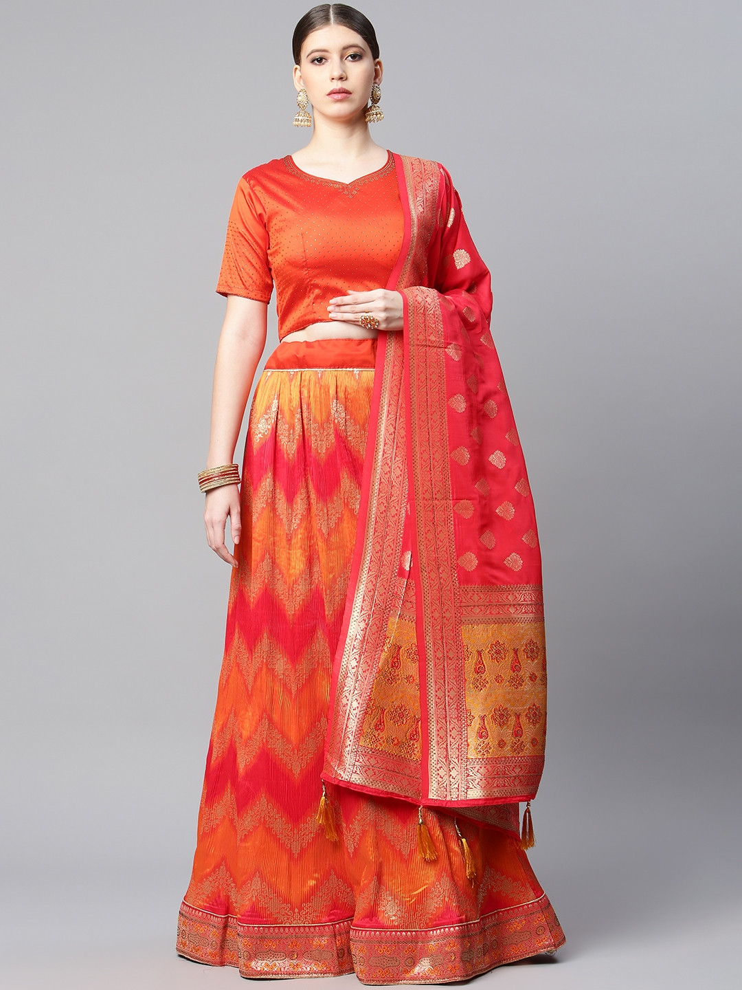 

CAMPAIGN TRENDS Coral Orange & Pink Semi-Stitched Lehenga & Unstitched Blouse With Dupatta