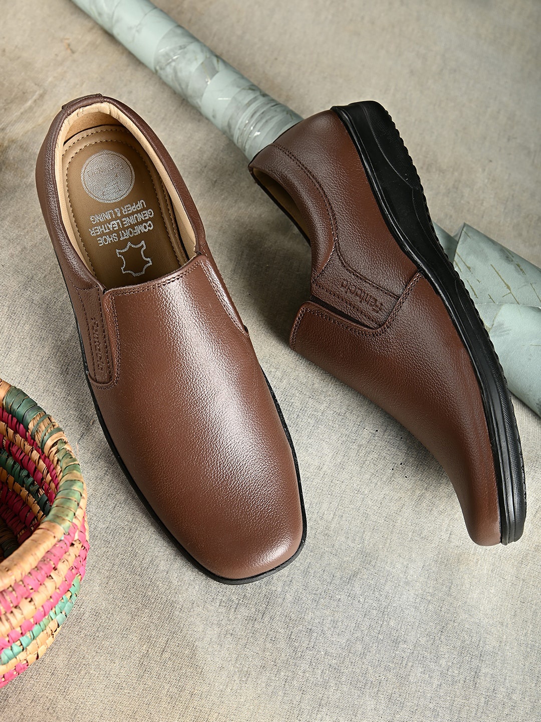 

Fentacia Men Brown Solid Formal Leather Slip-On Shoes