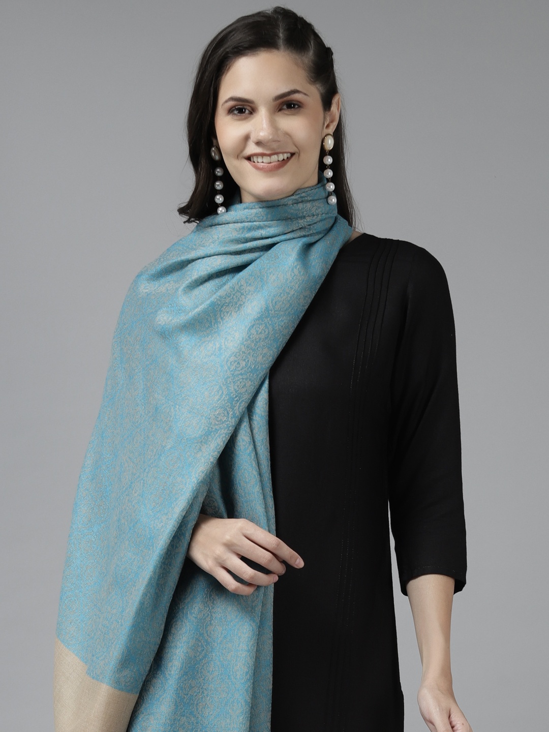 

Cayman Women Turquoise Blue & Beige Ethnic Motif Woollen Shawl