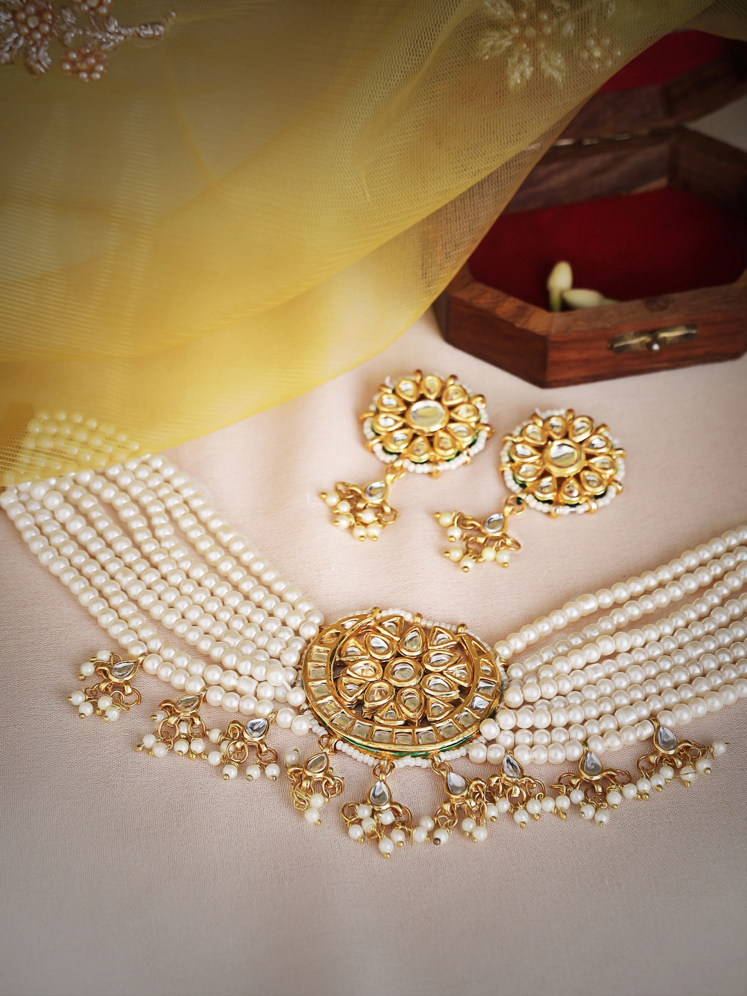 

Rubans Women Gold-Plated & White Kundan-Studded & Pearl Beaded Choker Jewellery Set