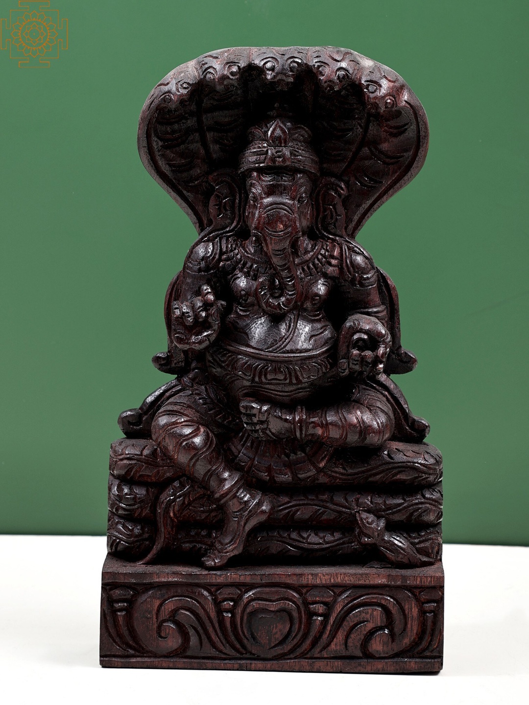 

Exotic India 12" Wooden Ganesha Idol Seated on Sheshnag Wall Hanging, Brown