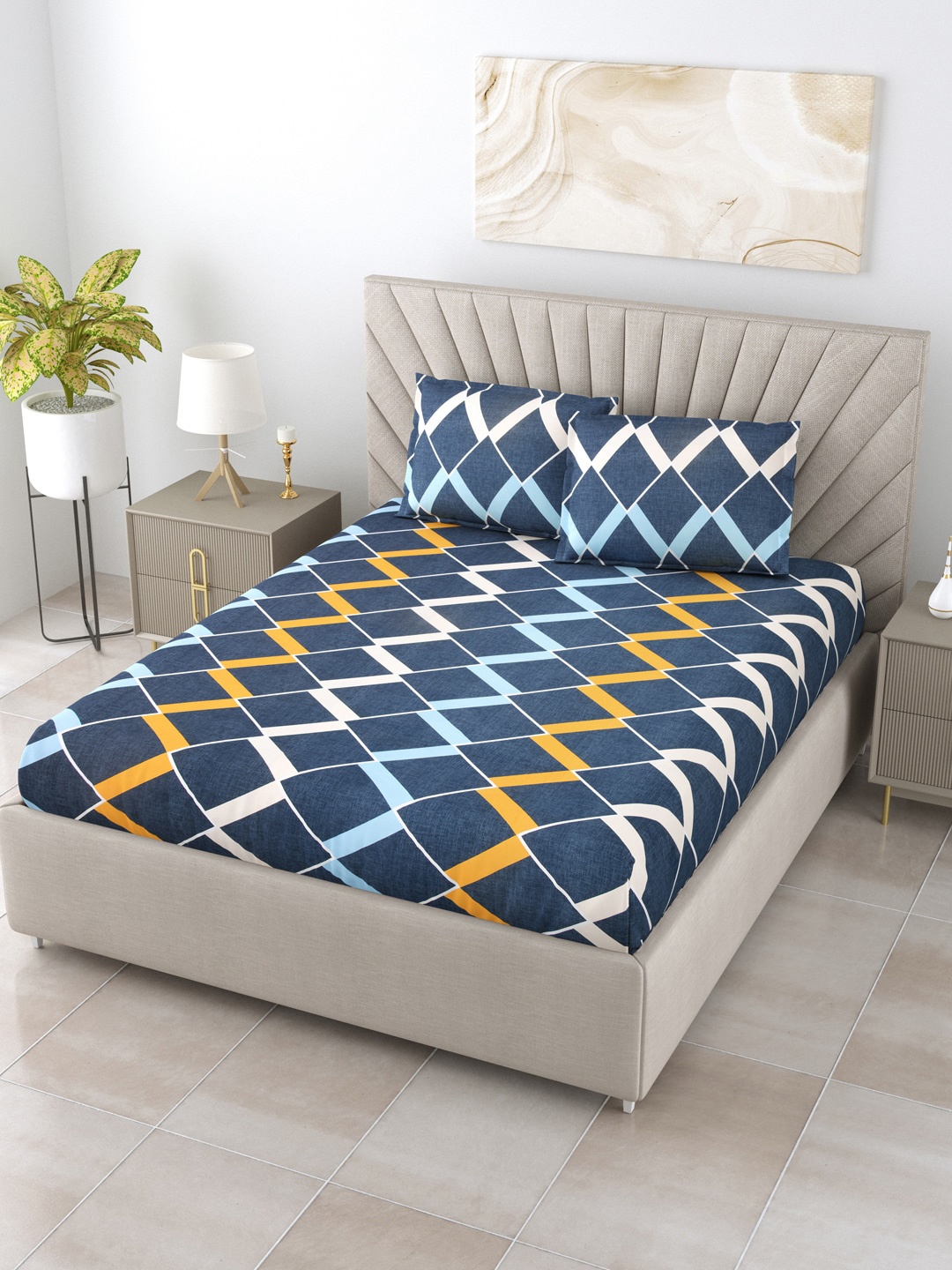 

Salona Bichona Navy Blue & Orange Geometric 180 TC Queen Bedsheet with 2 Pillow Covers