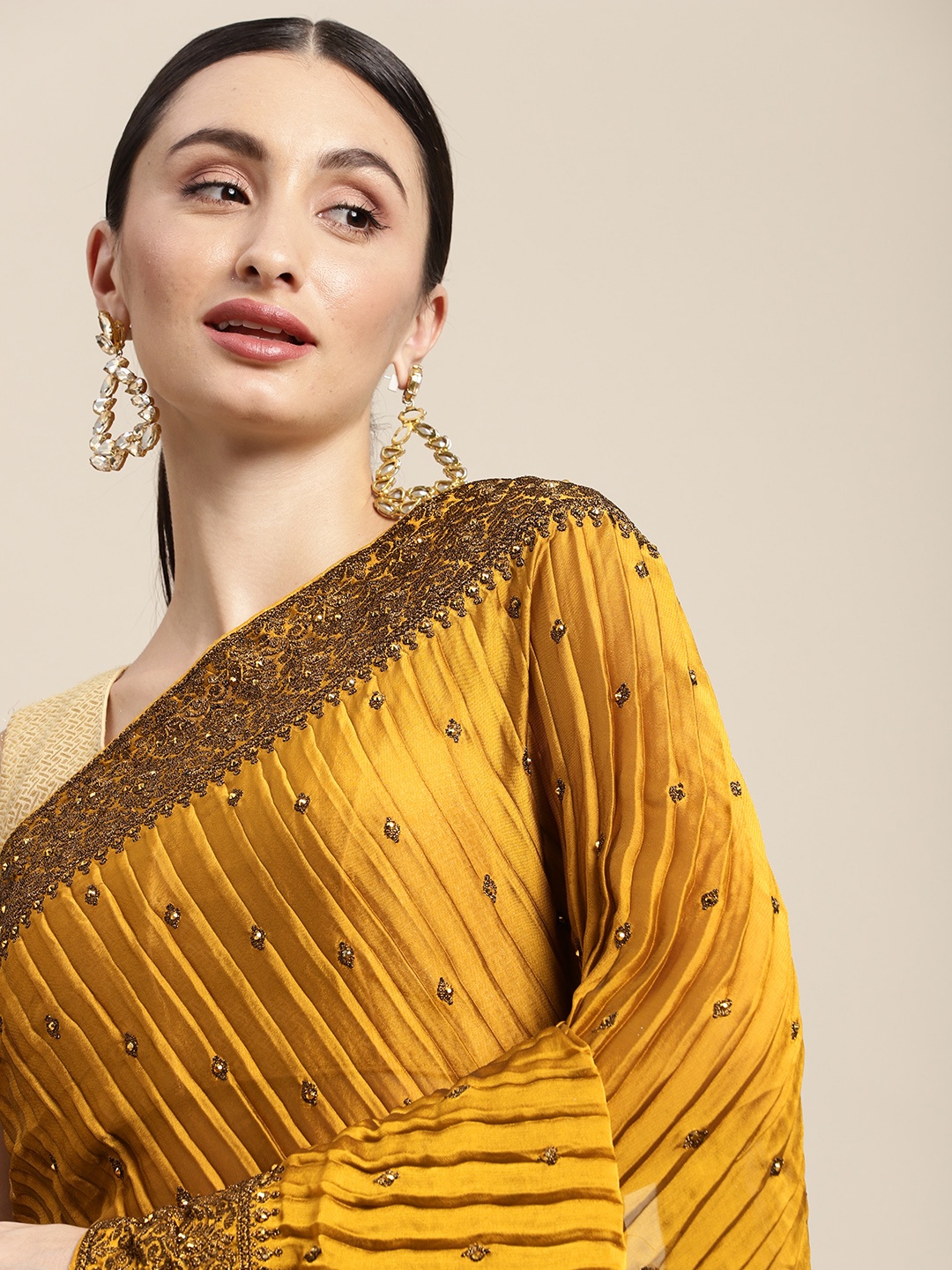 

Pothys Mustard Ethnic Motifs Embroidered Pure Chiffon Saree