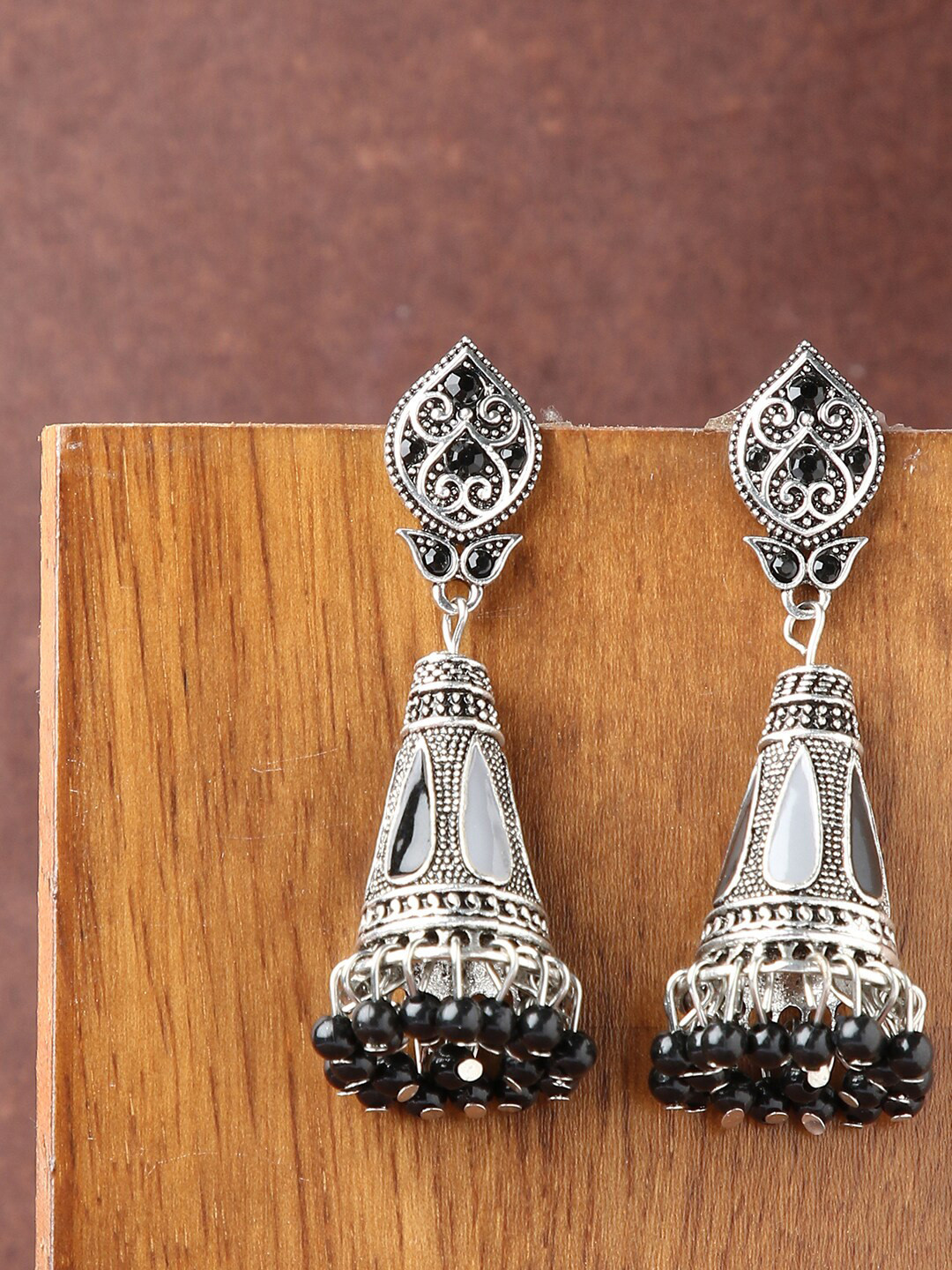 

SOHI Silver-Toned Teardrop Shaped Jhumkas Earrings
