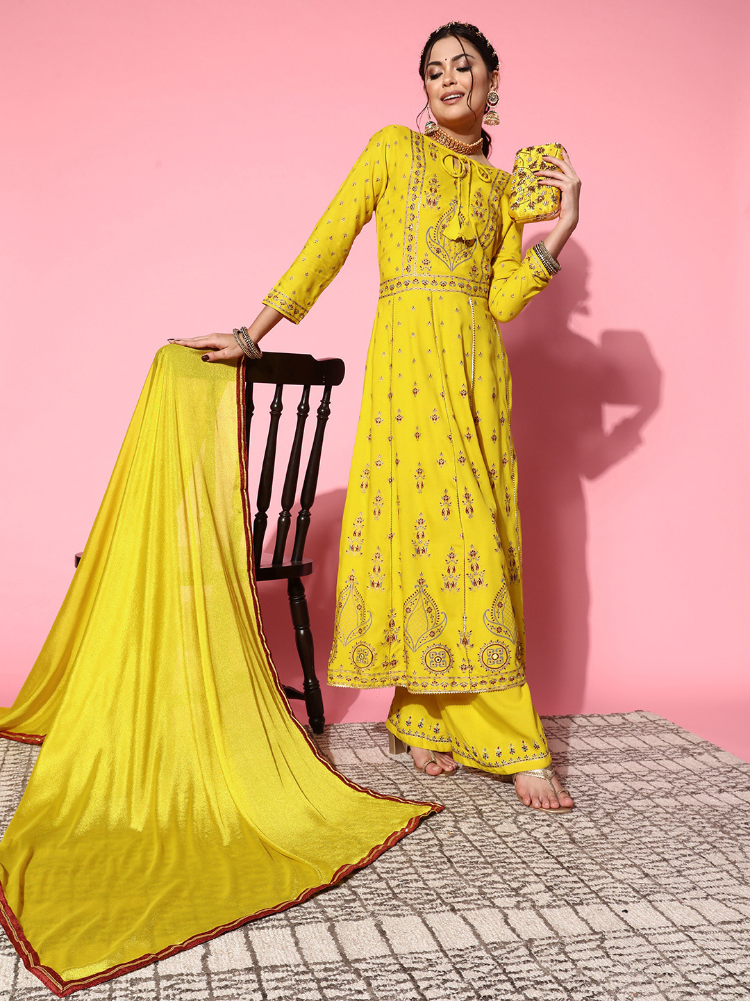 

Kvsfab Women Solid Viscose Rayon Fluid Tie-Up Kurta Set, Yellow