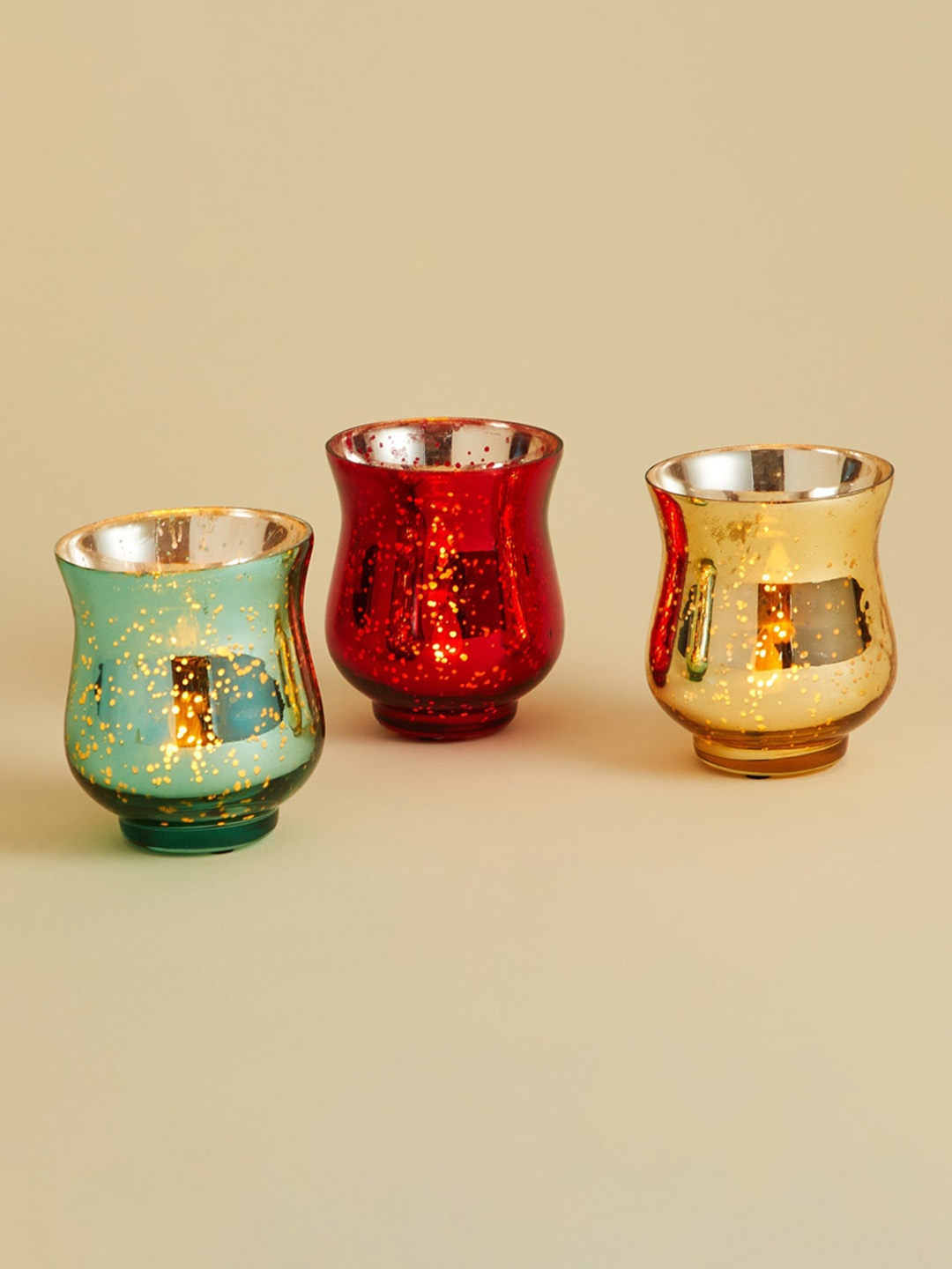 

Home Centre Set Of 3 Red Green & Gold-Toned Textured Glass Abstract Votive Holders