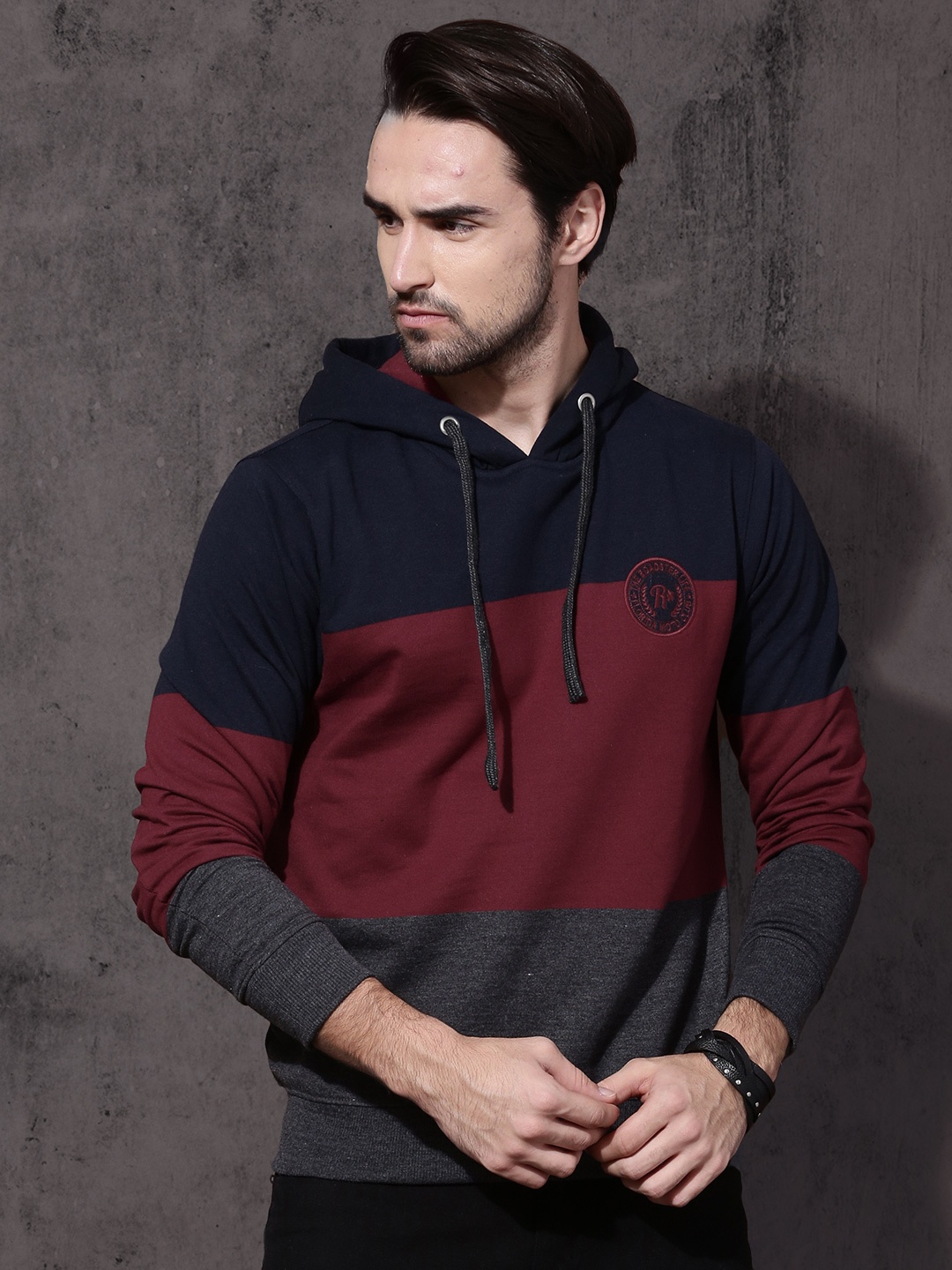 

Roadster Men Maroon & Navy Blue Colourblocked Hooded Sweatshirt