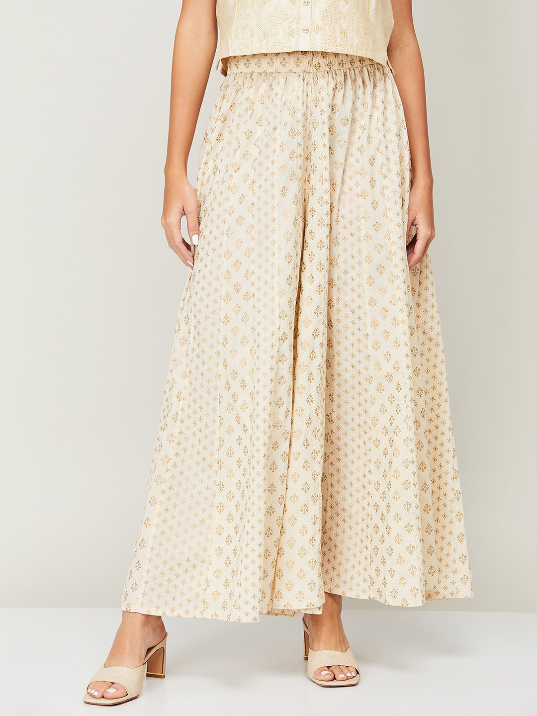 

Melange by Lifestyle Women White & Gold-Toned Ethnic Motifs Printed Knitted Palazzos