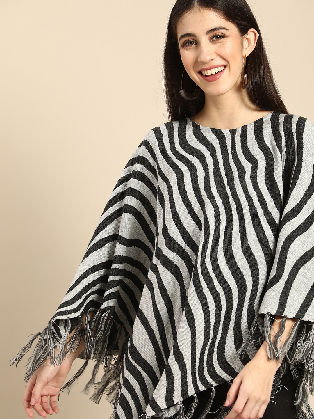 

Anouk Women White & Black Animal Printed Longline Poncho