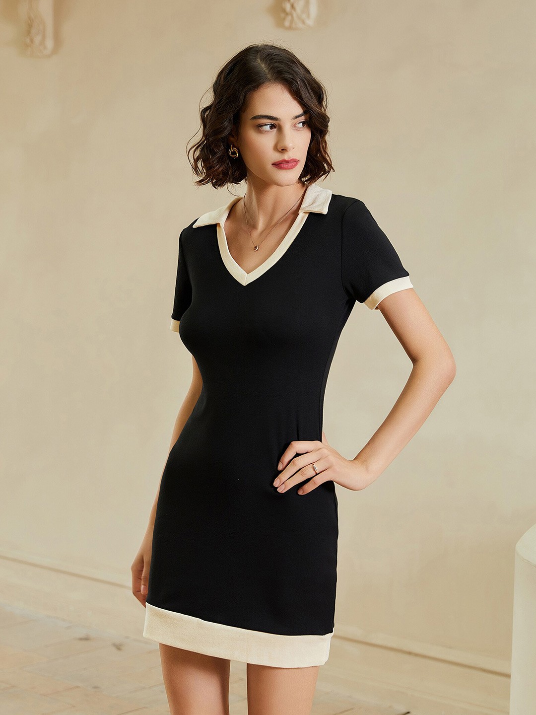 

URBANIC Black Solid Sheath Mini Dress