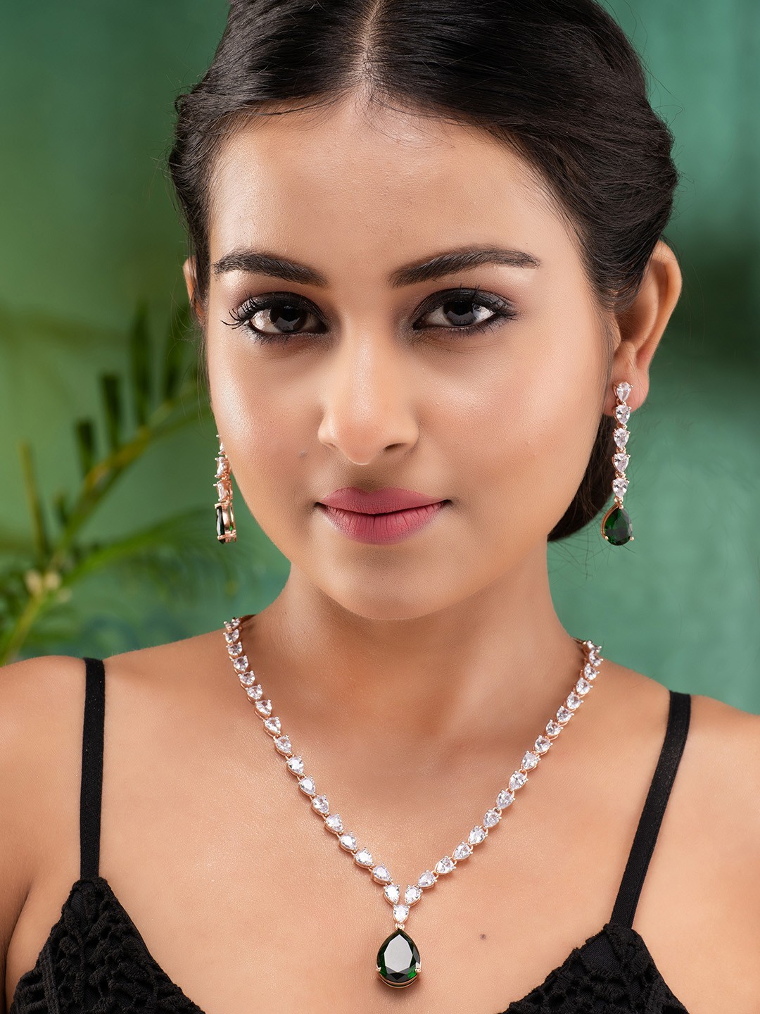 

Saraf RS Jewellery Rose Gold Toned Emerald Green Studded Designer Pendant Jewellery Set
