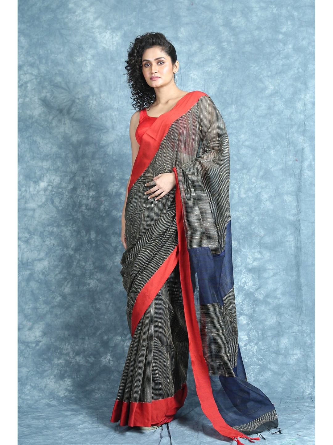 

Arhi Black & Red Striped Cotton Blend Saree