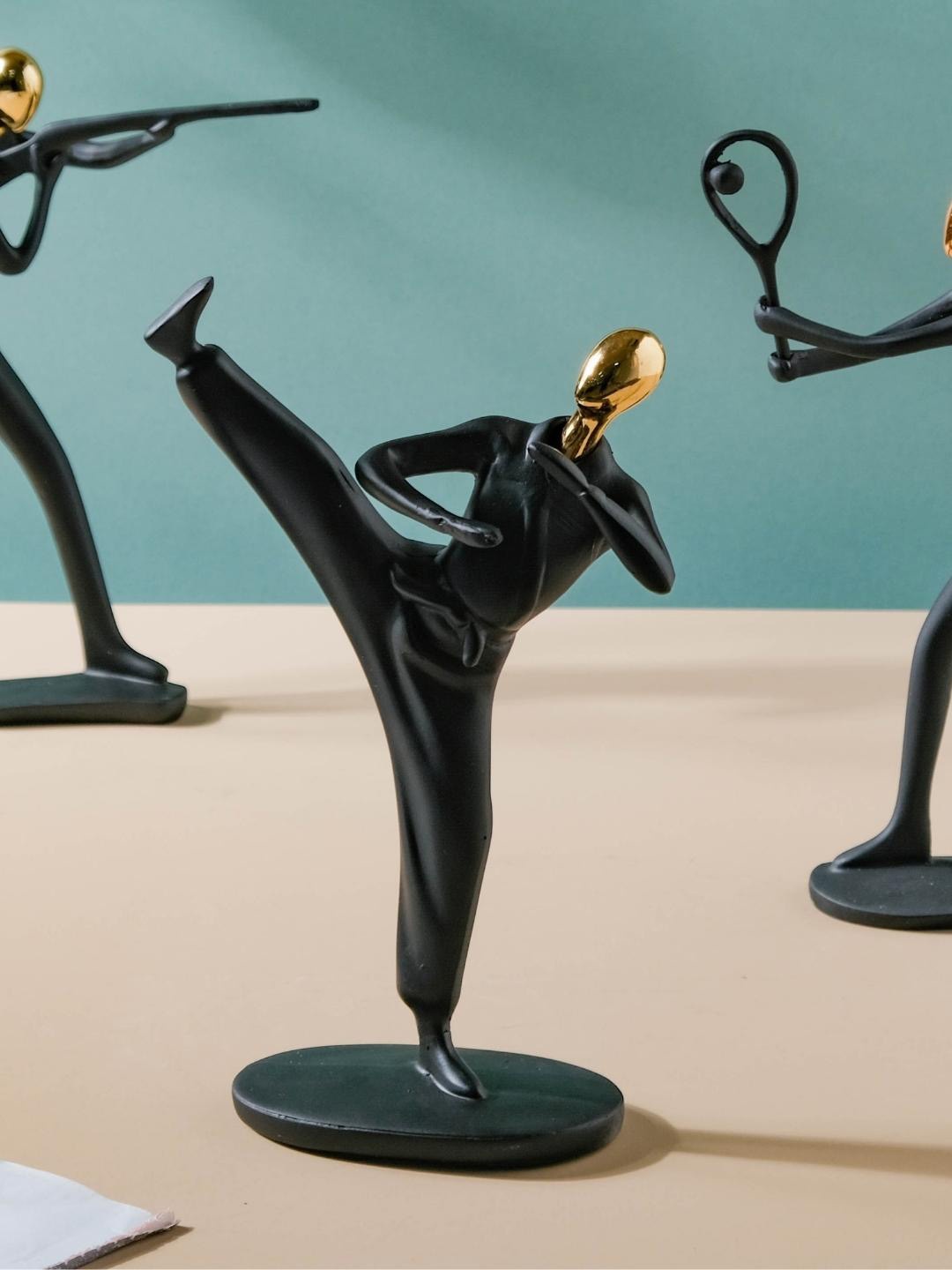 

Nestasia Gold-Toned & Black Solid Martial Arts Sportsman Figurine
