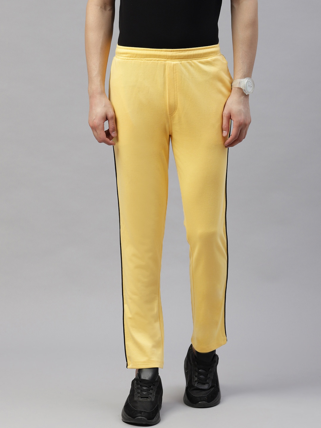 

Pierre Carlo Men Solid Slim Fit Track Pants, Yellow