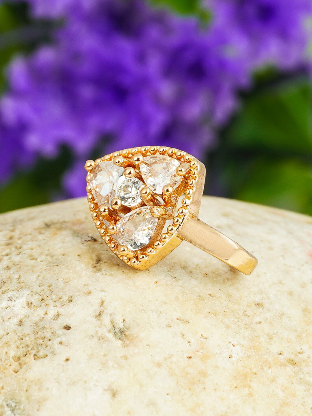 

Urmika Gold-Toned & White Crystal Studded Triangular Shaped Nose Pin