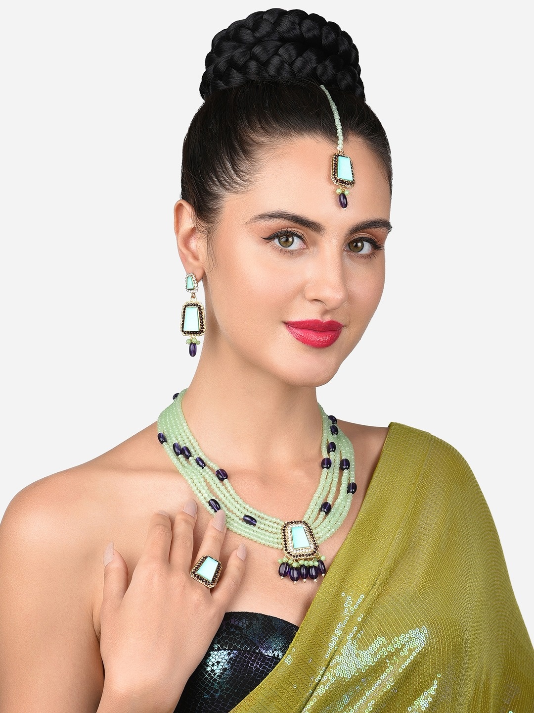 

Zaveri Pearls Gold-Plated Green & Purple Stone Studded & Beaded Jewellery Set