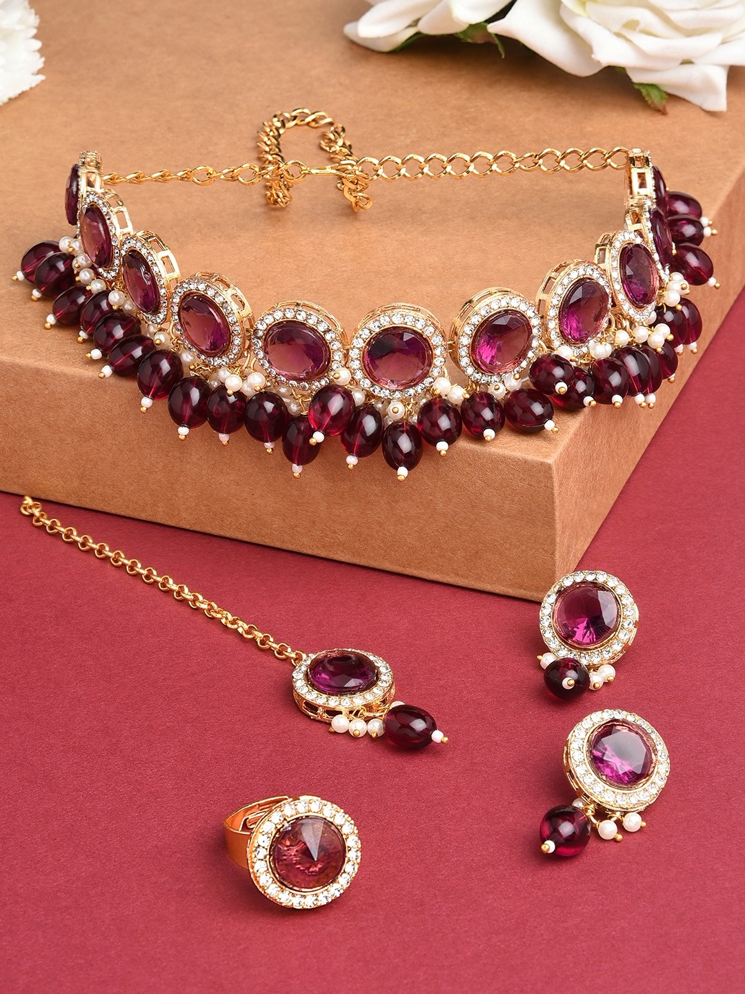 

Zaveri Pearls Gold-Plated Maroon & White Stone Studded & Pearls Beaded Jewellery Set