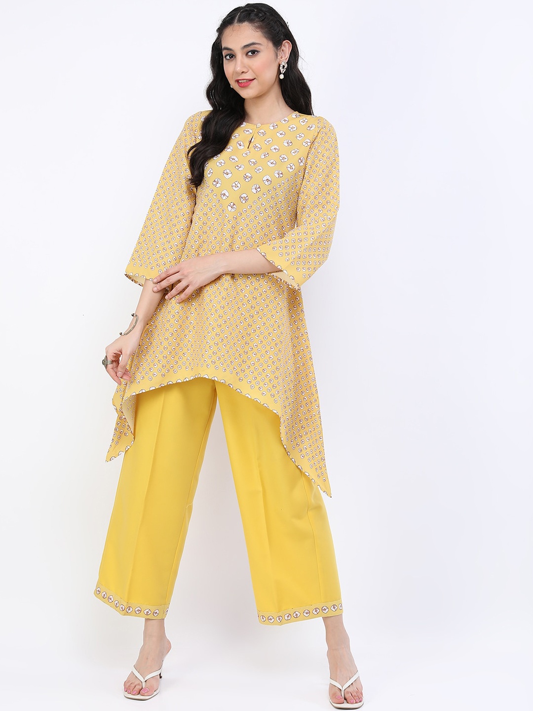 

Vishudh Women Mustard Yellow Floral Printed Layered Kurti with Palazzos