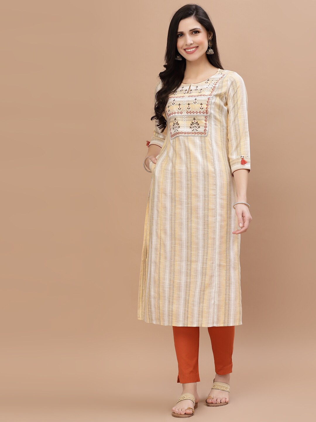 

Smiro Women Yellow Striped Keyhole Neck Thread Work Kurta