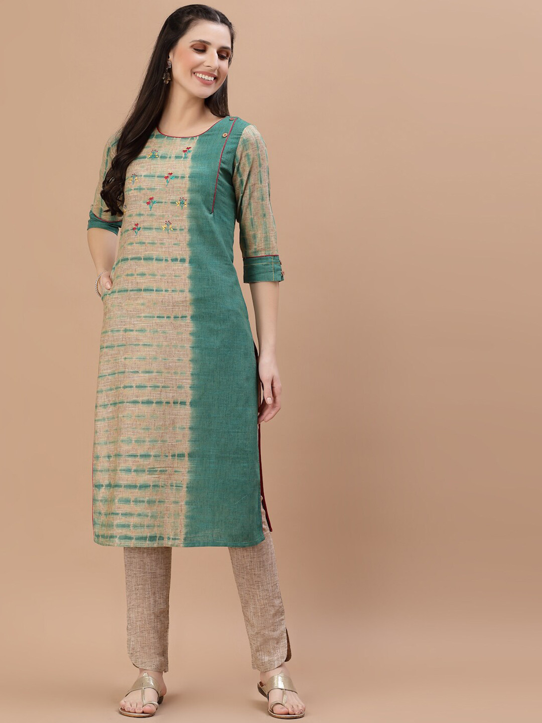 

Smiro Women Teal & Beige Floral Colourblocked Thread Work Kurta