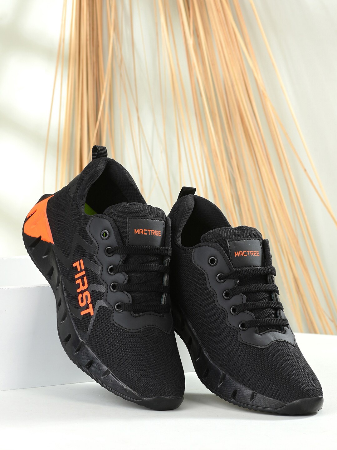 

Mactree Men Black Textured Lightweight Sneakers