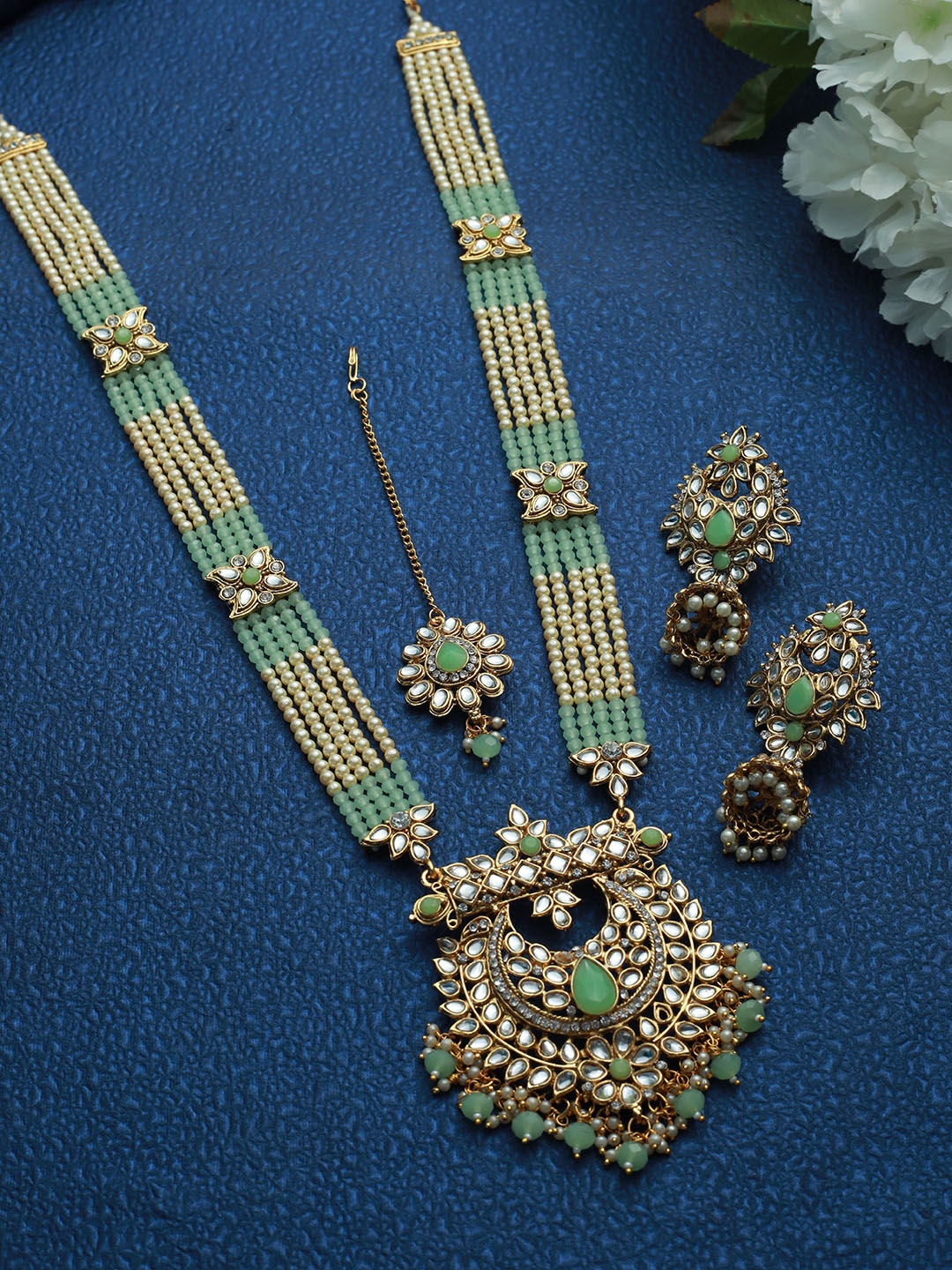 

Jazz and Sizzle Gold-Plated Green & White Kundan Studded & Beaded Jewellery Set