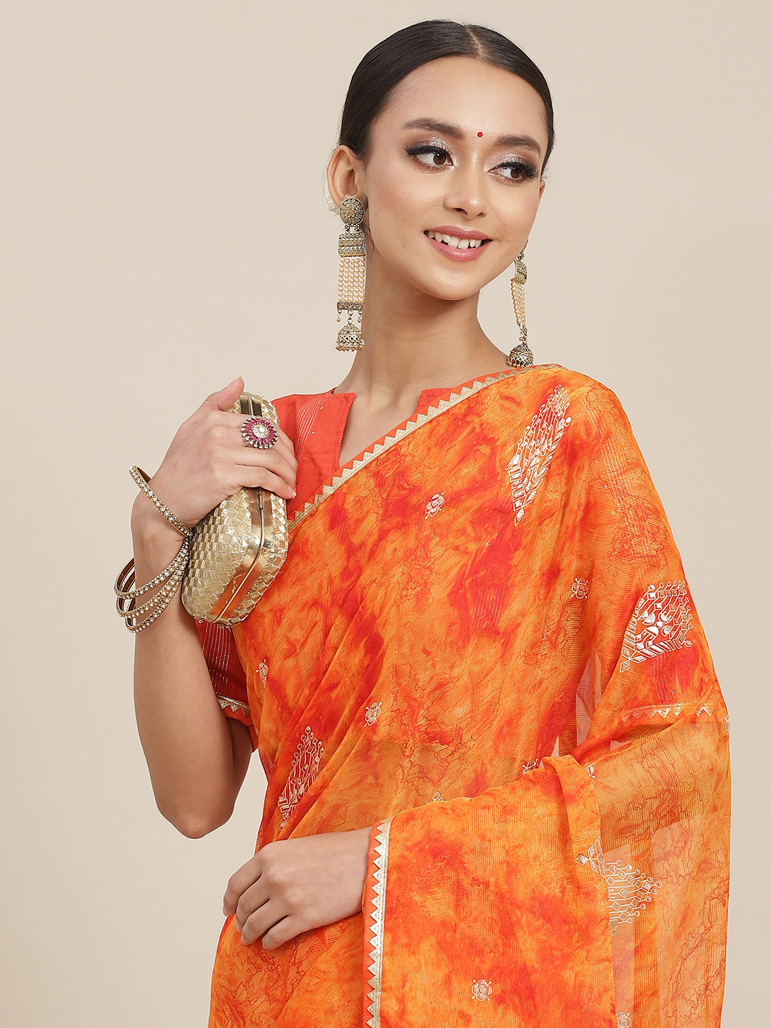 

Satrani Orange Dyed Embellished Saree