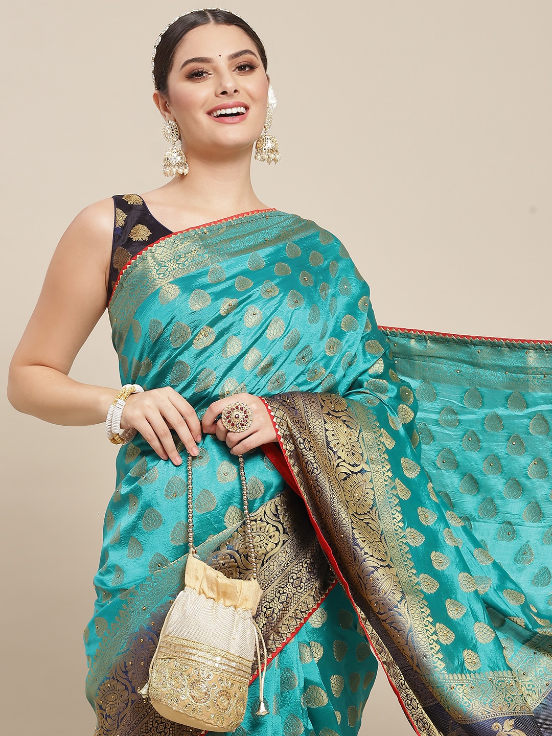 

SAARYA Green & Golden Ethnic Motifs Poly Georgette Saree