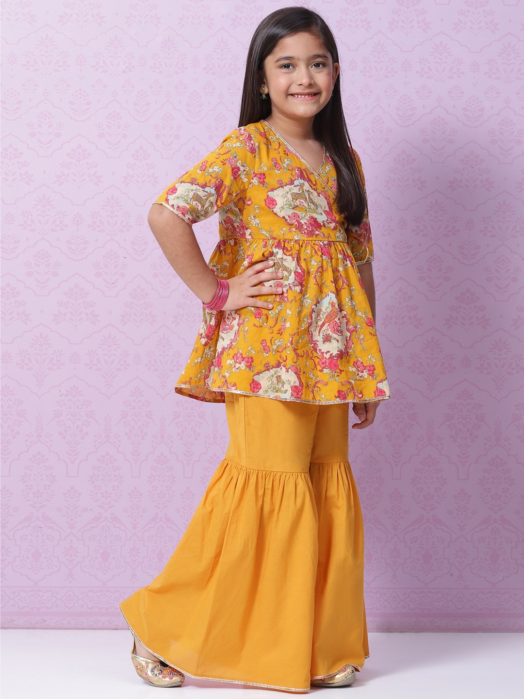 

Biba Girls Mustard Yellow & Pink Ethnic Motifs Printed Angrakha Cotton Kurta with Sharara