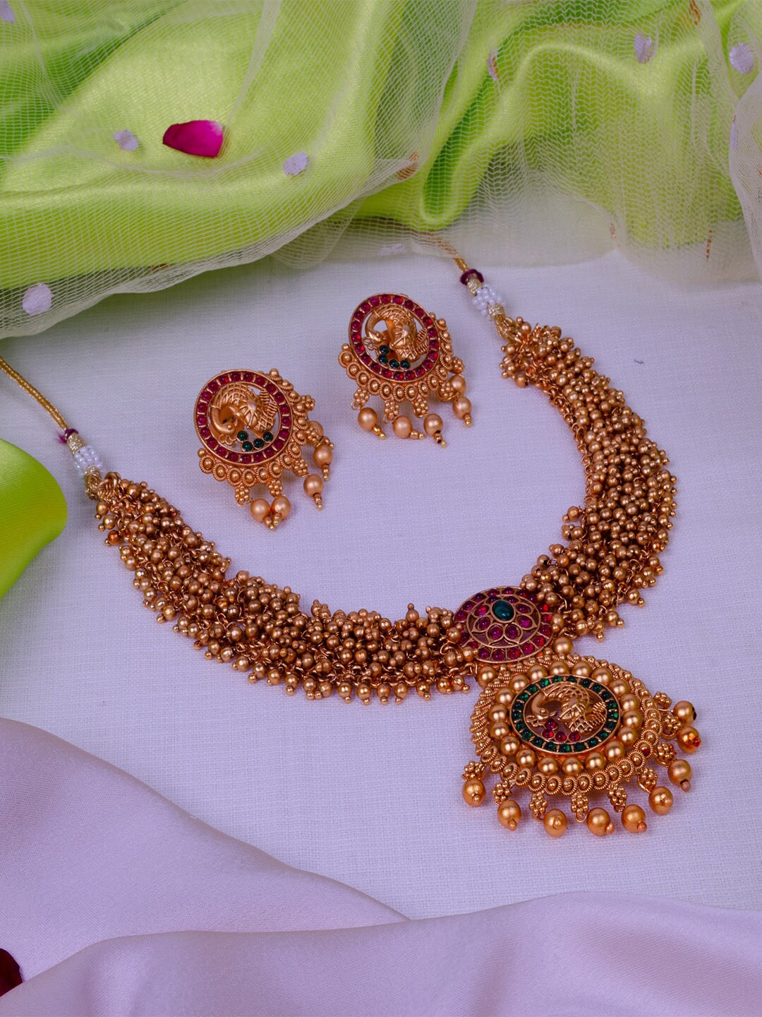 

StileAdda Gold-Plated Green & Red Stone Studded & Beaded Jewellery Set