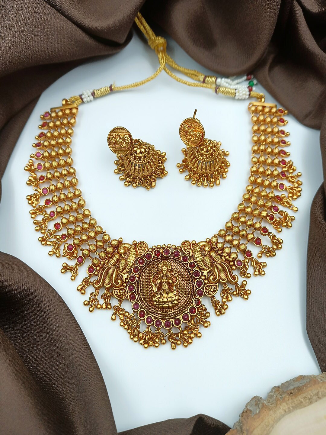 

StileAdda Gold-Plated Purple Stone Studded Temple Jewellery Set