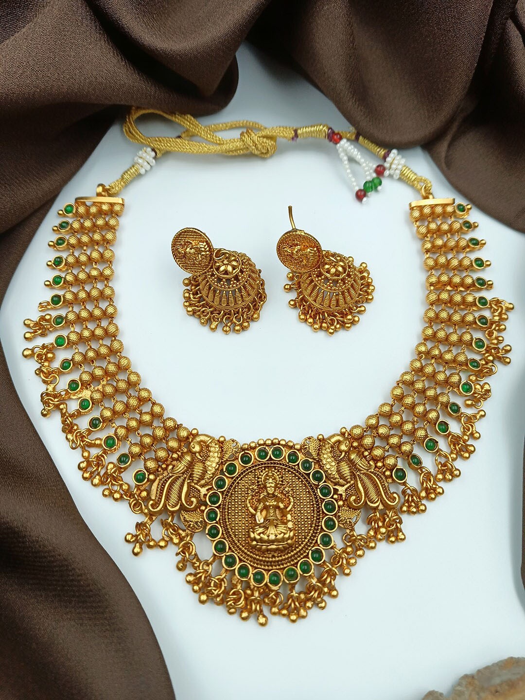 

StileAdda Gold-Plated Green Stone Studded & Beaded Temple Jewellery Set