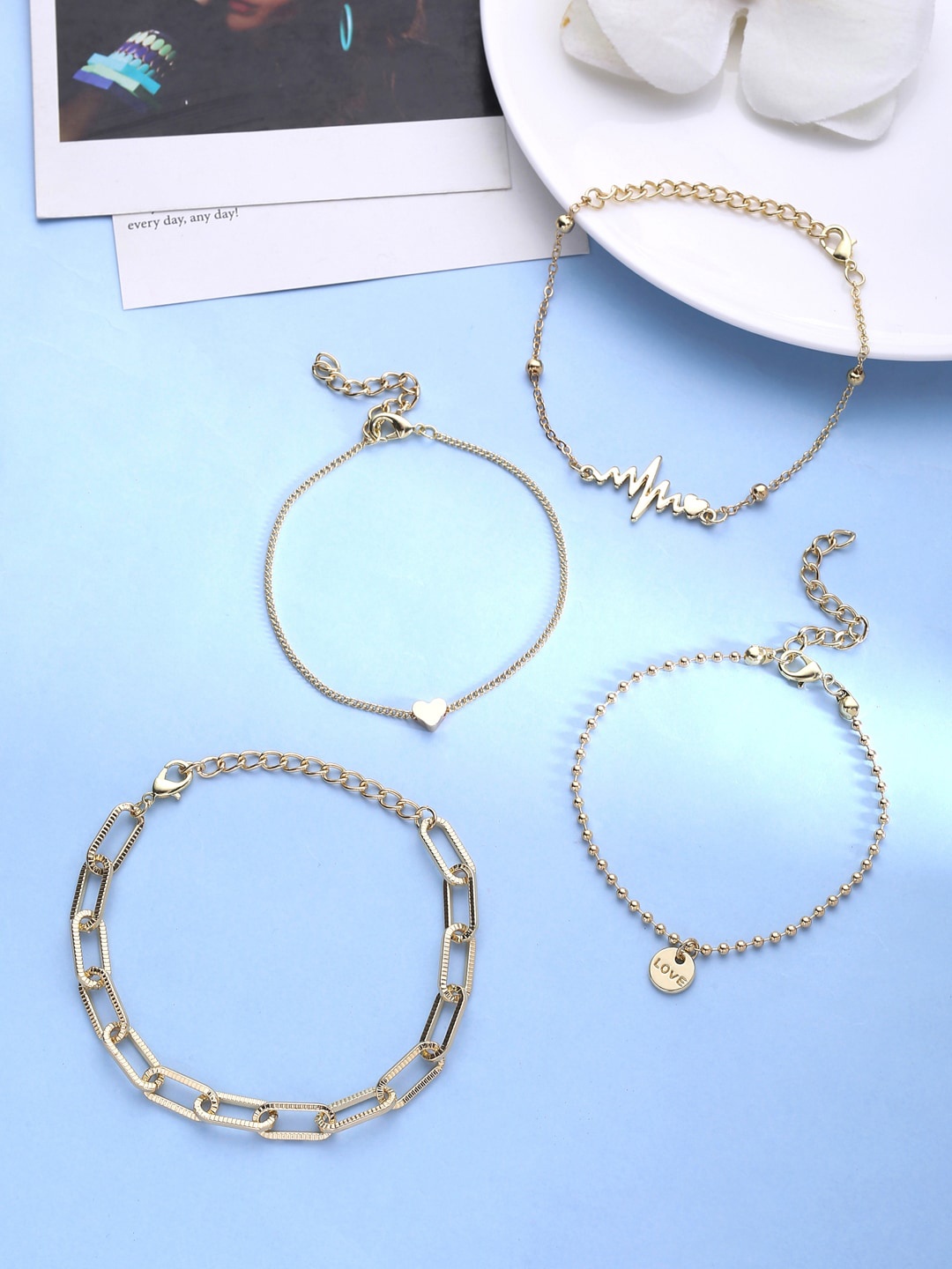

kashwini Pack Of 4 Women Gold-Toned & White Brass Gold-Plated Charm Bracelet