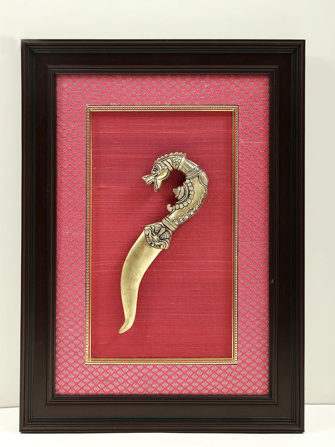 

Exotic India Gold-Toned & Black Dragon Head Khanjar Framed Wall Hanging