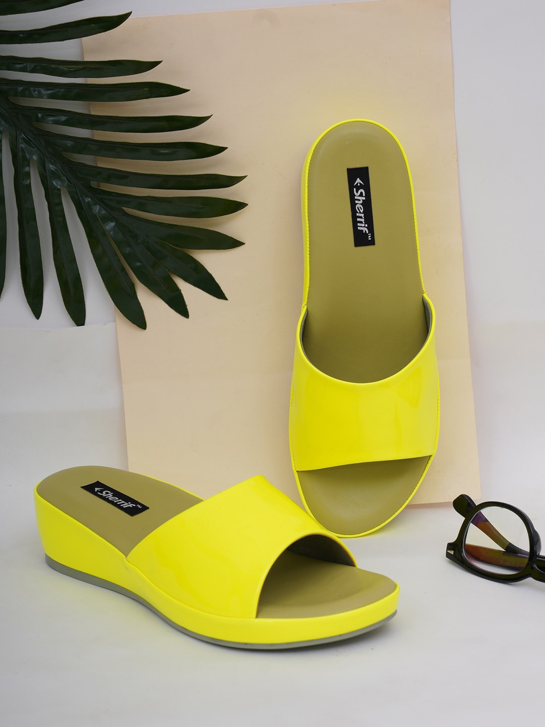 

Sherrif Shoes Yellow Solid Wedge Mules