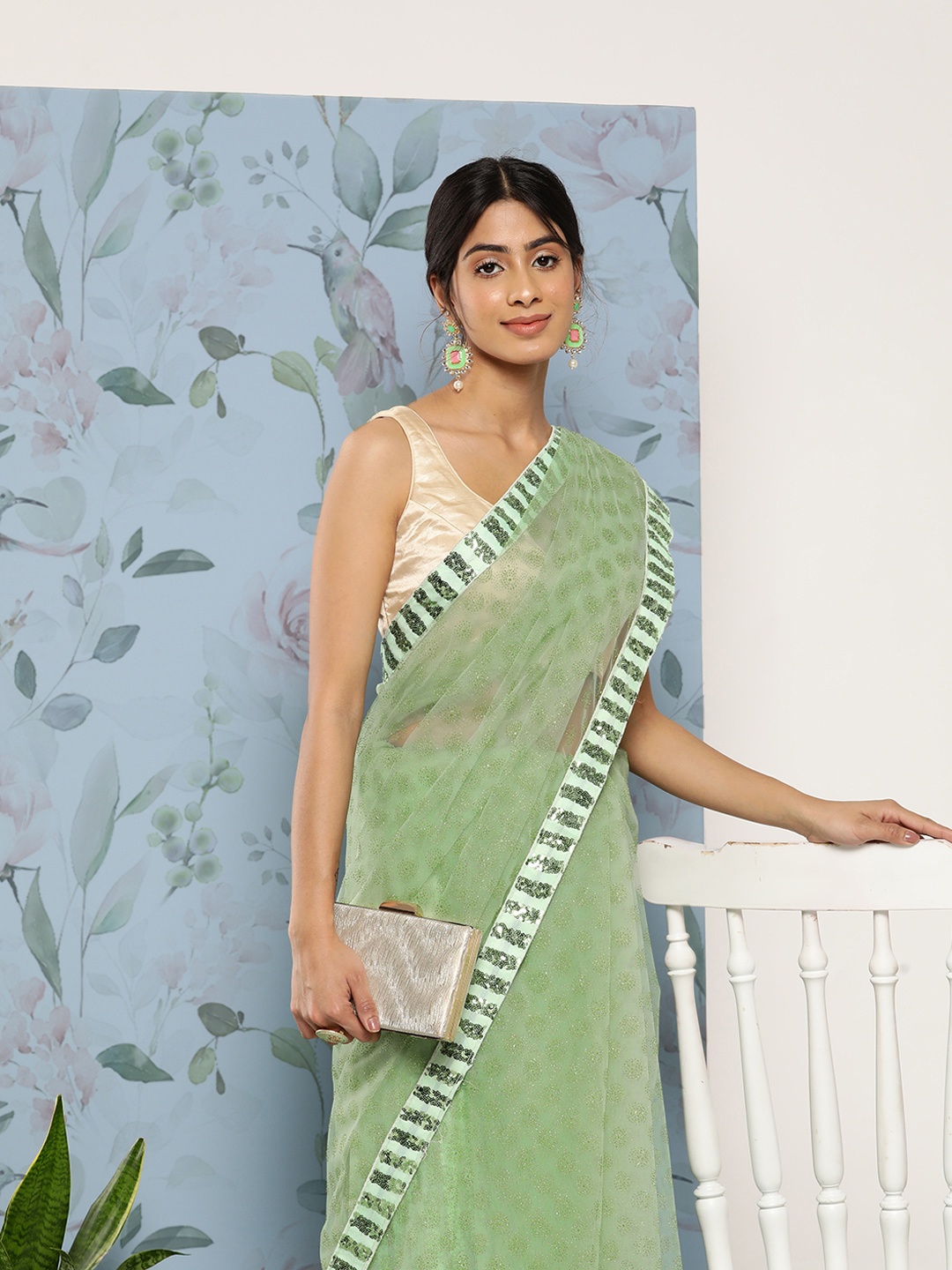 

SAARYA Woman Green Embellished Net Saree