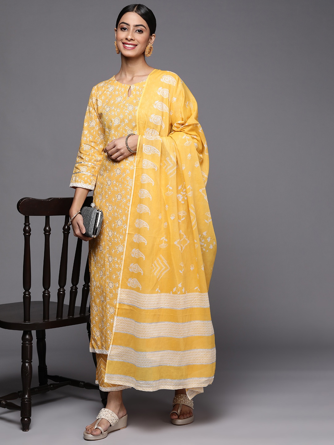 

Indo Era Women Yellow Floral Printed Kurta with Palazzos & With Dupatta