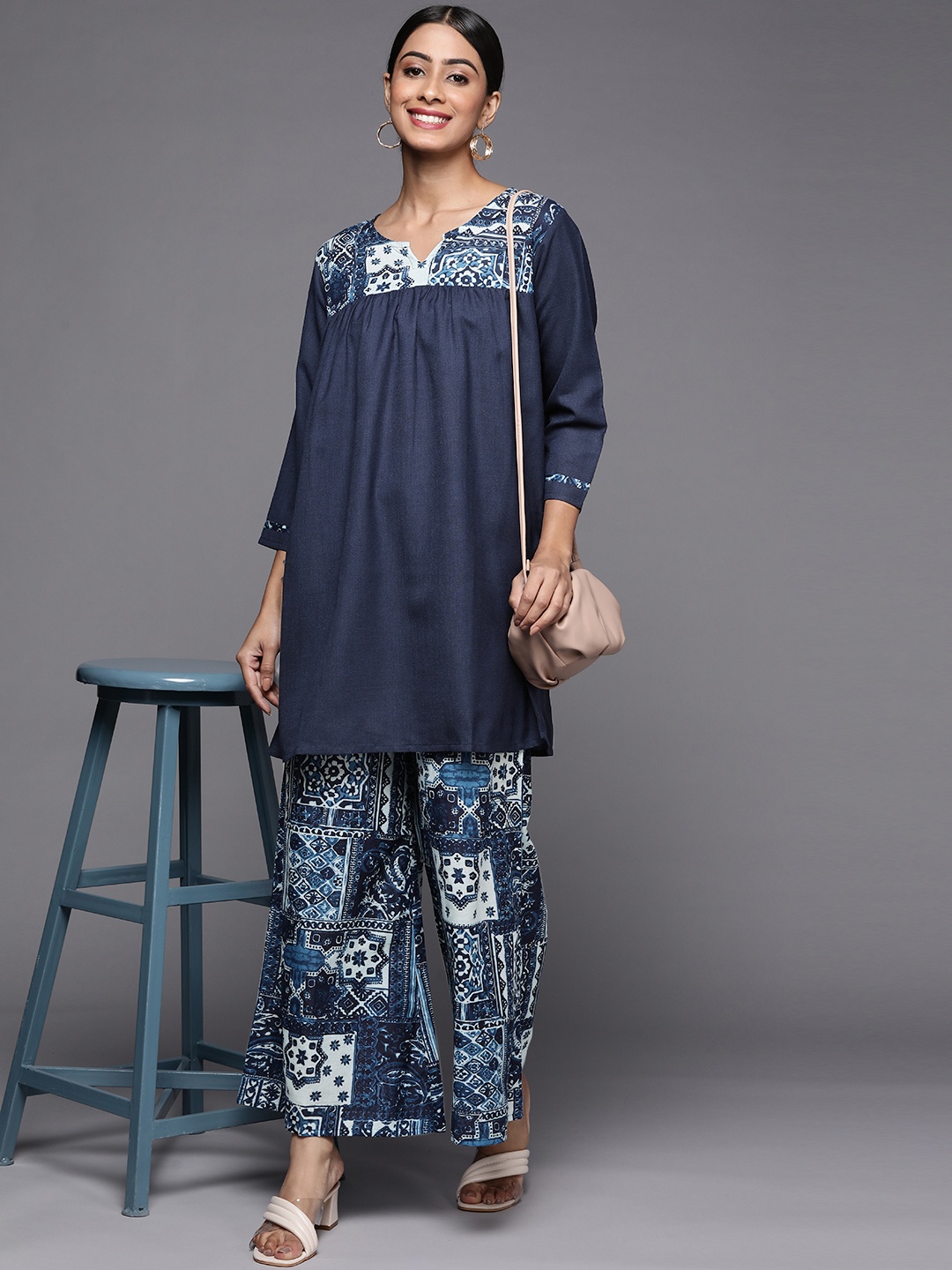 

Indo Era Woman Navy Blue Floral Kurta with Palazzos