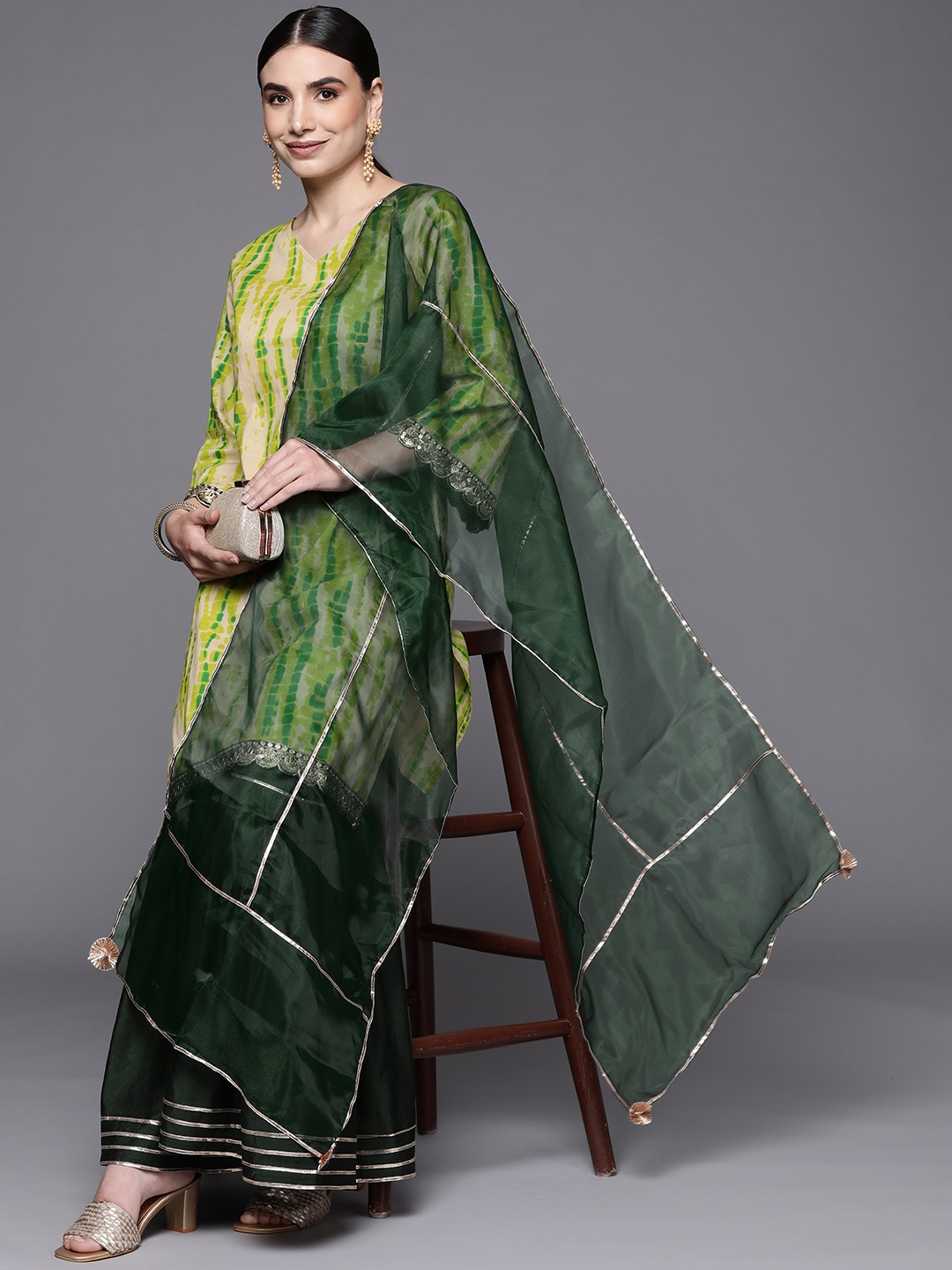

Indo Era Women Green Dyed Sequinned Kurta with Sharara & With Dupatta