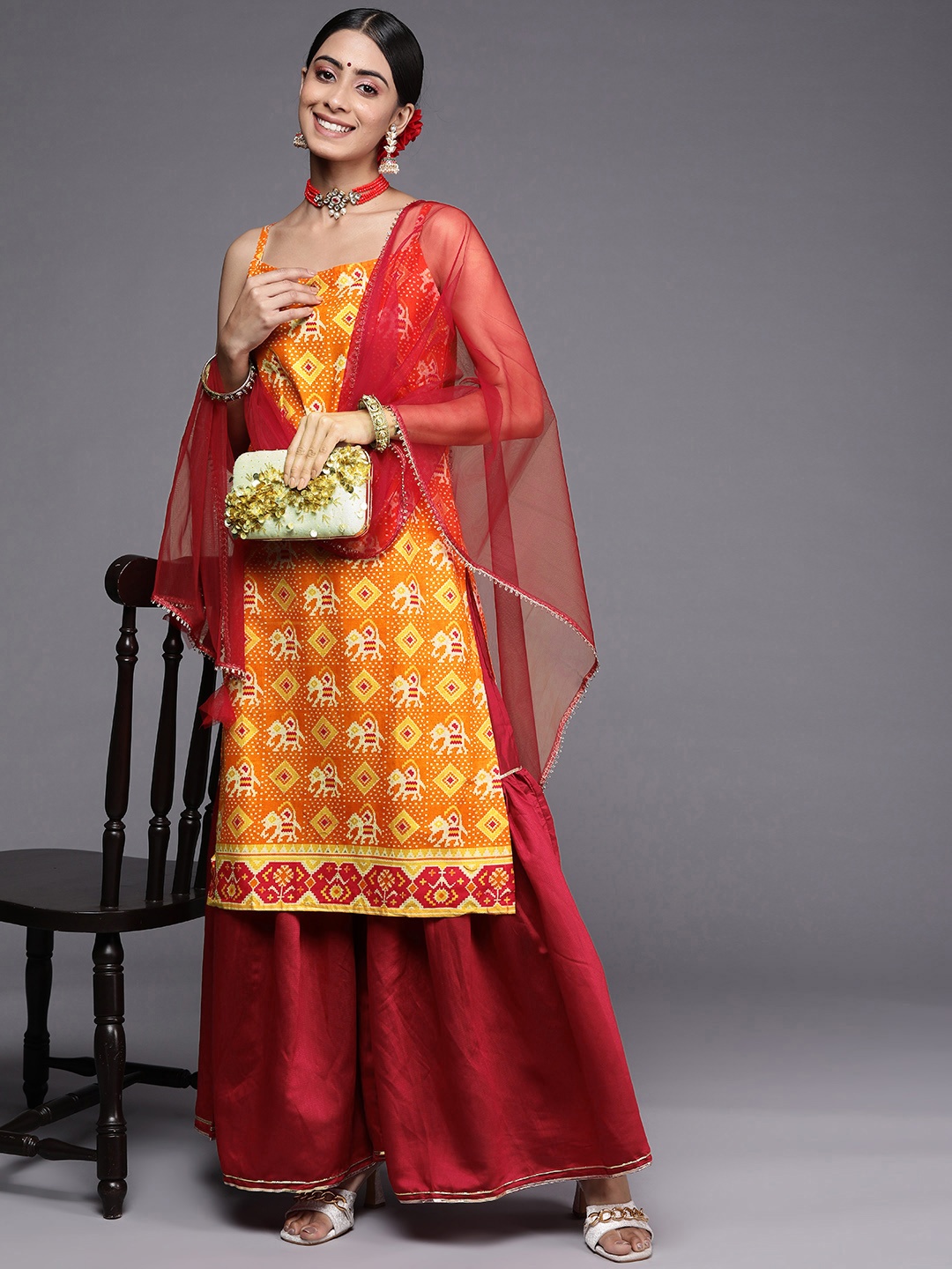 

Indo Era Women Orange Printed Kurta with Sharara & With Dupatta