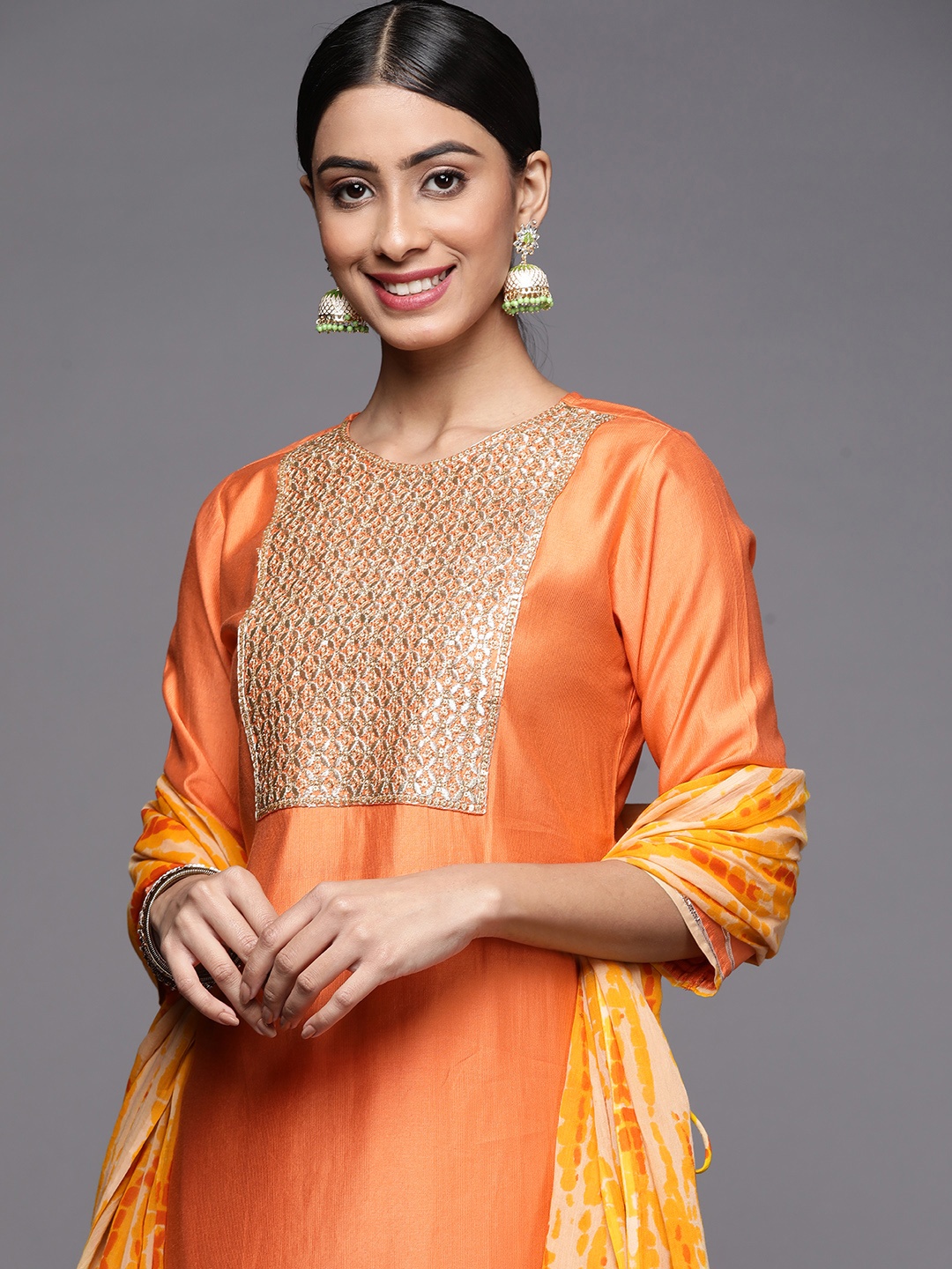 

Indo Era Women Orange Bandhani Dyed Liva Kurta with Sharara & With Dupatta