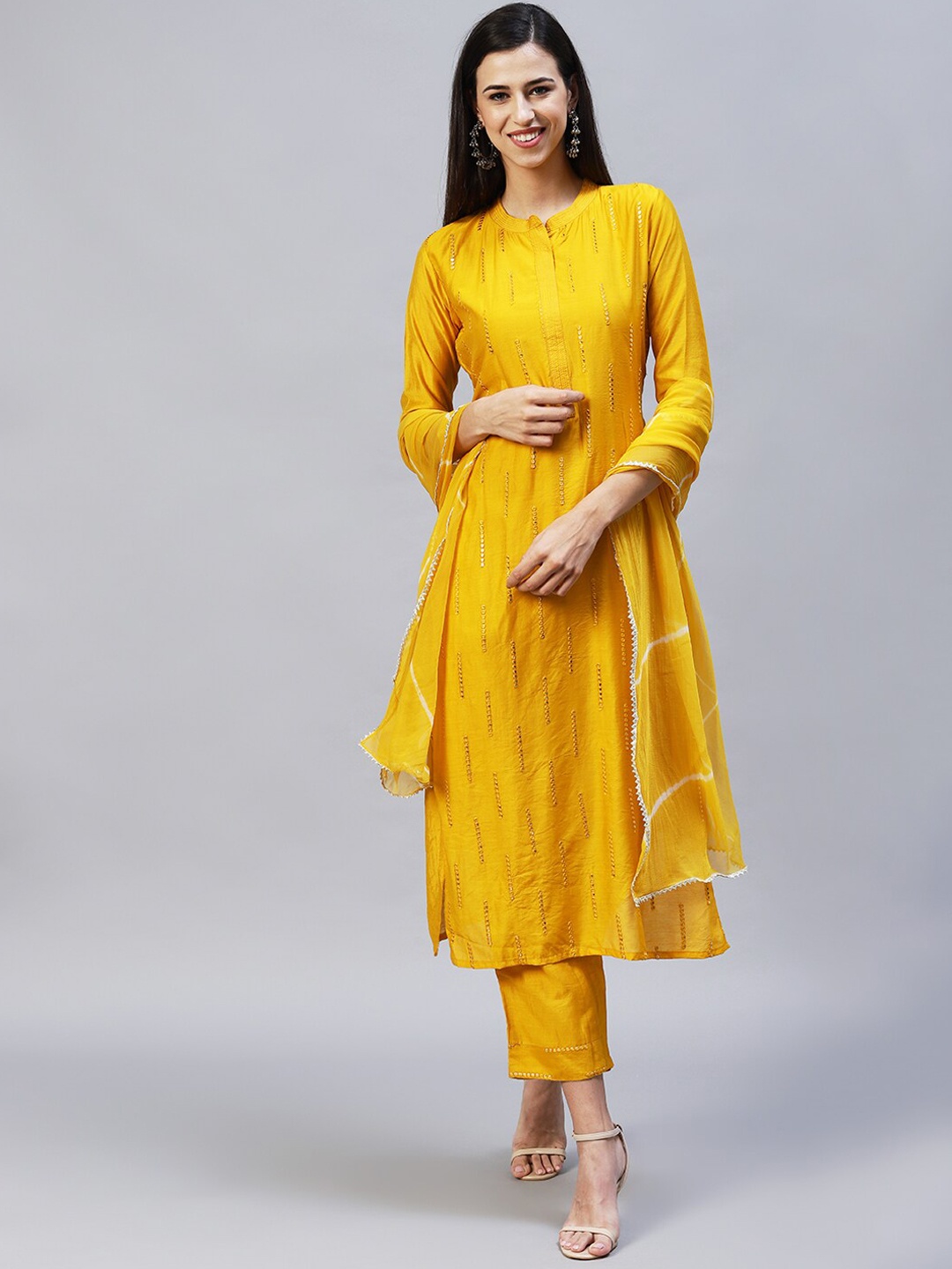 

FASHOR Women Yellow Embroidered Mirror Work Kurta with Trousers & Dupatta