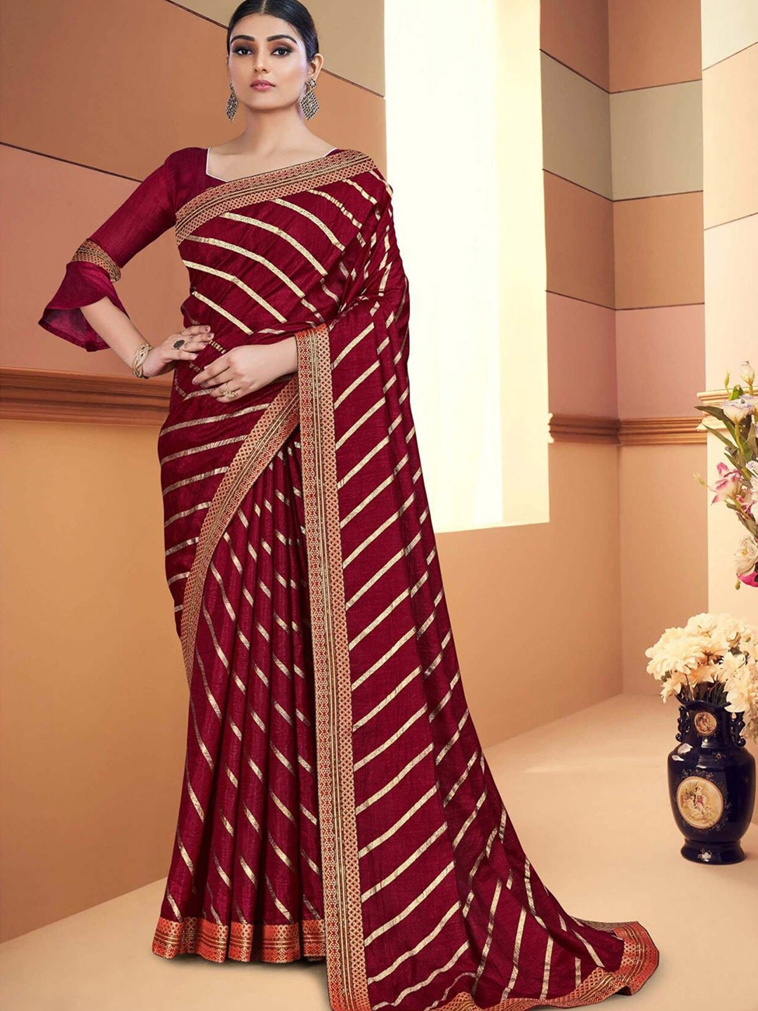 

AVANTIKA FASHION Maroon & Gold-Toned Striped Zari Art Silk Banarasi Saree